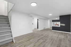 Basement featuring LVP wood-style flooring