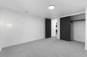 Unfurnished bedroom with a closet