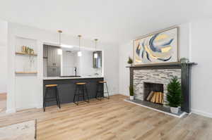 Living room featuring a fireplace and LVP wood-style floors