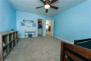 Bedroom #3 featuring a closet, ceiling fan, a spacious closet, and carpet floors