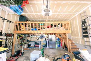 2-Car garage featuring large storage loft and extra depth