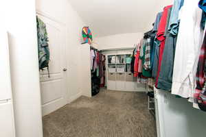 Master Walk in closet featuring carpet flooring