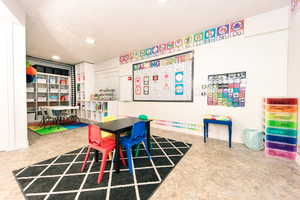 Recreation/bedroom room with tile floors