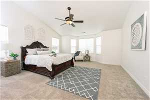 Carpeted Master with vaulted ceiling and ceiling fan