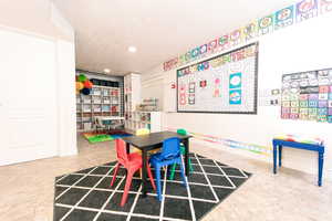 Playroom/bedroom with tile floors