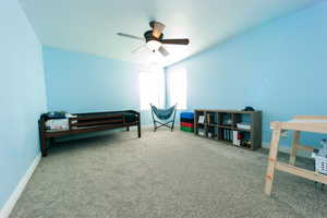 Bedroom #3 featuring a closet, ceiling fan, a spacious closet, and carpet floors