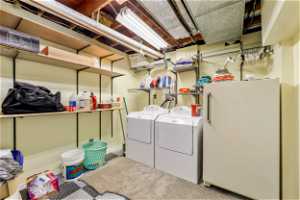 Laundry room featuring hookup for a washing machine and washing machine and clothes dryer