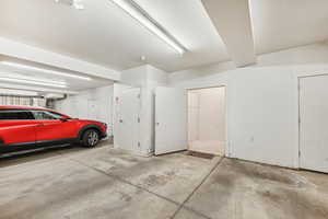 View of garage with large storage closet