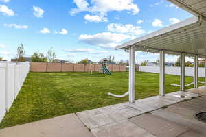 View of yard featuring a playground