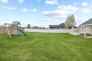 View of yard featuring a playground