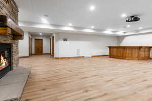 Unfurnished living room with light hardwood / wood-style flooring and a fireplace