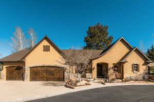 French provincial home featuring a garage