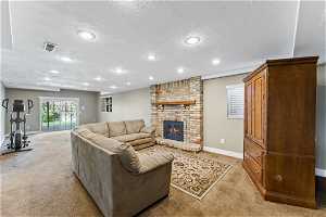 Lower level large family room with inviting fireplace and walkout to backyard