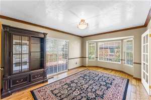 Formal dining room with walkout to deck and hardwood flooring