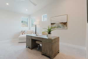 Office space with light colored carpet, lofted ceiling, recessed lighting, and ceiling fan