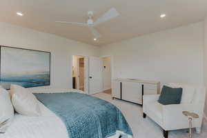 Bedroom featuring recessed lighting, light colored carpet, and ceiling fan