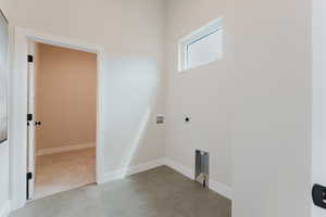 Laundry room with hookup for a washing machine and electric dryer hookup