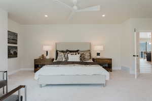 Bedroom featuring light colored carpet, recessed lighting, and a ceiling fan
