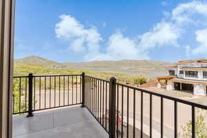 Balcony with a water and mountain view