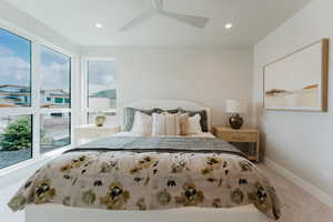 Carpeted bedroom with recessed lighting and a ceiling fan