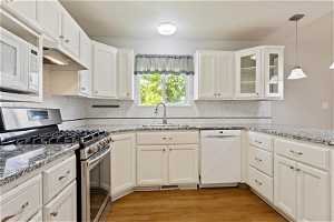 Freshly Updated Kitchen with Granite Countertops and Gas Range
