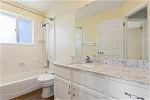 Freshly Updated Bathroom with Granite Cuntertops and Tub/Shower