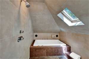 Upper level primary suite with spa-style wet room/bath
