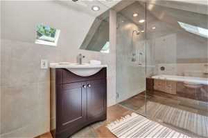 Upper level primary suite spa-style wet room/bath