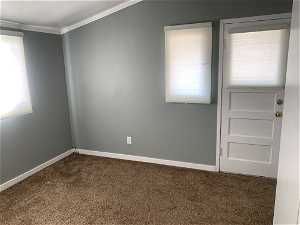Carpeted bedroom 3 featuring crown molding