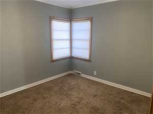 Carpeted bedroom 2 with ornamental molding