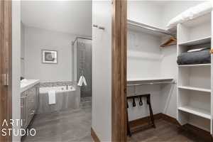 Main level en'suite bathroom with double sink vanity, soaking tub and separate shower.