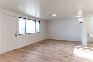 Living room featuring light hardwood(LVP) / wood-style flooring