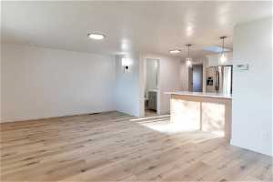 Interior space with light hardwood (LVP)/ wood-style floors