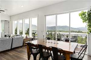 Dining space with a mountain view and dark hardwood / wood-style floors
