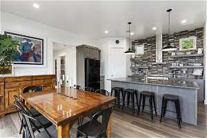 Dining room with sink and dark hardwood / wood-style floors