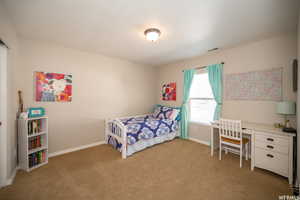 View of carpeted bedroom