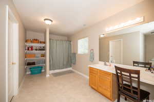 Bathroom featuring vanity and tile floors