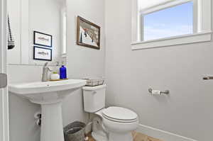 Bathroom with wood-type flooring and toilet