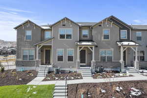 View of front of property featuring central AC