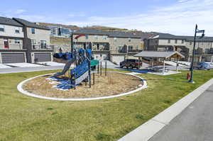 View of jungle gym with a yard