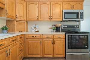 Kitchen with appliances with stainless steel finishes