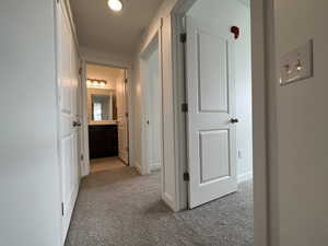 Hallway with carpet floors