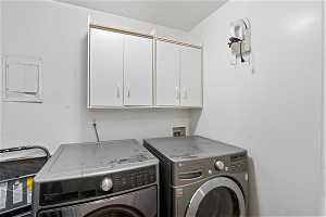 Spacious laundry room with room for full-size washer/dryer and additional storage.