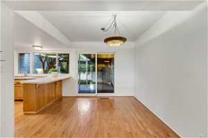 Unfurnished room featuring light hardwood / wood-style flooring and sink