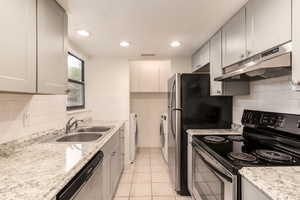 Updated kitchen with convenient laundry location - all appliances included!