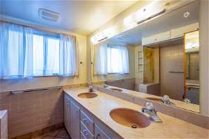 Basement Full Bath with Solid Surface Counter Tops and Double Sinks!