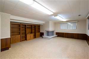 Large Basement Family Room with Built-in Bookshelves and Cozy Gas Fireplace!