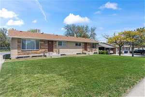 Rambler style home with beautiful  front lawn