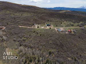 Birds eye view of property featuring a mountain view