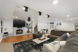 Family room featuring hardwood / wood-style flooring and a large fireplace